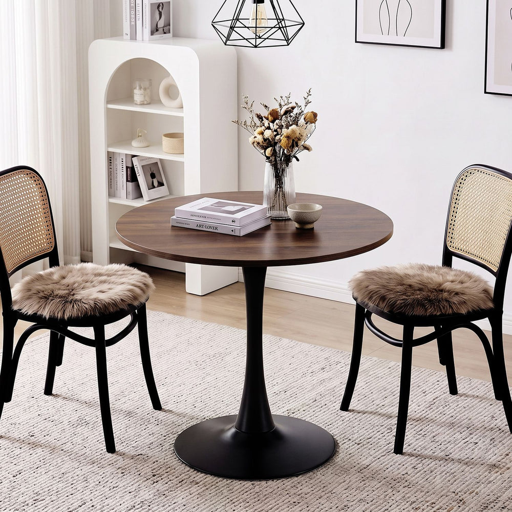 Round 31.5-inch walnut tulip table with a metal pedestal, perfect for small dining spaces or cafes.