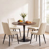 Round 31.5-inch walnut tulip table with metal pedestal, perfect for small dining spaces and easy to clean.