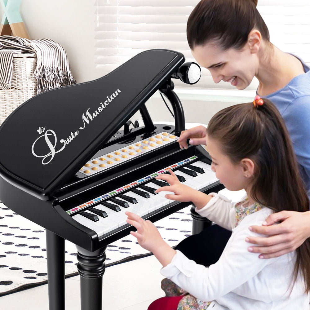 Kids piano keyboard with 31 keys, LED lights, and microphone, perfect for fun music learning and singing practice.