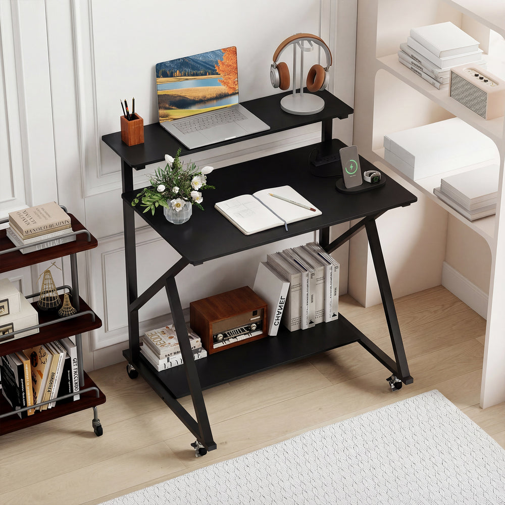 Rolling black computer desk with ergonomic monitor shelf, power outlets, and compact design for small spaces.
