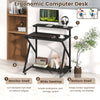 Rolling computer desk with ergonomic monitor shelf, black finish, and built-in power outlets for small spaces.