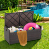 Patio storage bench with seat cushion, made of brown PE rattan, ideal for outdoor storage and seating by the pool.