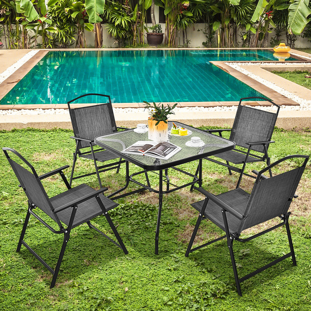 Square 34-inch outdoor dining table with tempered glass top and umbrella hole, set in a poolside garden.