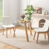 Round glass dining table with rubber wood frame, 36 inches wide, ideal for living or dining room use.