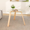 Round glass dining table with a natural rubber wood frame, 36" wide, suitable for living room or dining room use.
