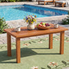 Rectangular outdoor coffee table with slatted top, made of solid hardwood, perfect for backyard gatherings.