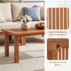 Rectangular outdoor coffee table with slatted top, solid hardwood, and reinforced corner blocks for durability and.