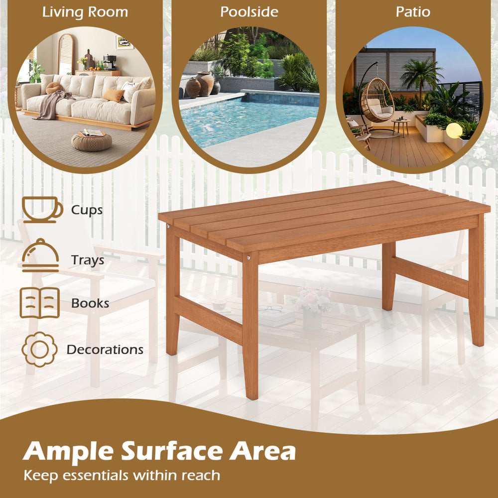 Solid wood outdoor coffee table with a rectangular slatted top and teak finish, ideal for patios and poolside use.