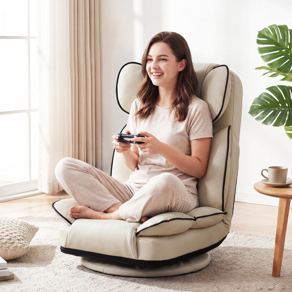 360° swivel floor gaming chair in cream PU leather, featuring a 6-position adjustable backrest for gaming and relaxing.