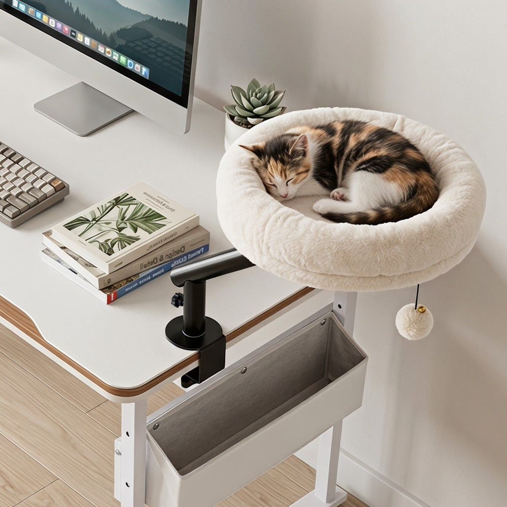 Cozy 360° rotating cat desk bed in white, designed for indoor cats, with removable perch and hanging bell toy for play.