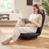 Black 360° swivel floor gaming chair with adjustable backrest, providing ergonomic support for comfortable seating.
