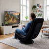 360° swivel gaming chair in black and gray with adjustable backrest, ideal for lounging and gaming in any room.