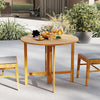 Round 36-inch outdoor folding dining table made of acacia wood, perfect for backyard gatherings and easy storage.