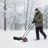 Wheeled 36-inch snow shovel with a powder-coated blade and 10" anti-slip tires for stable snow removal on smooth.