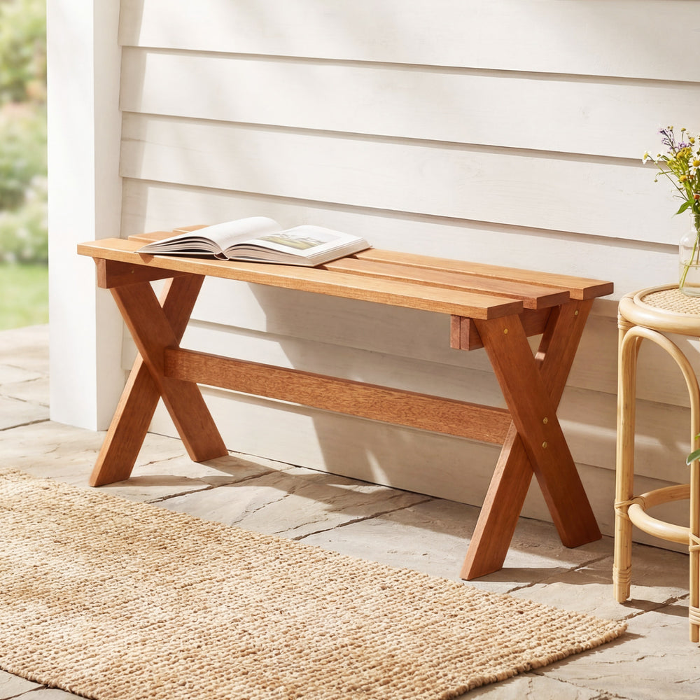 Backless 36" outdoor solid wood bench with teak oil finish, featuring X-shaped legs for stability, ideal for patios and.
