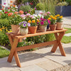Solid wood backless patio dining bench with teak oil finish, featuring X-shaped legs, perfect for garden seating.