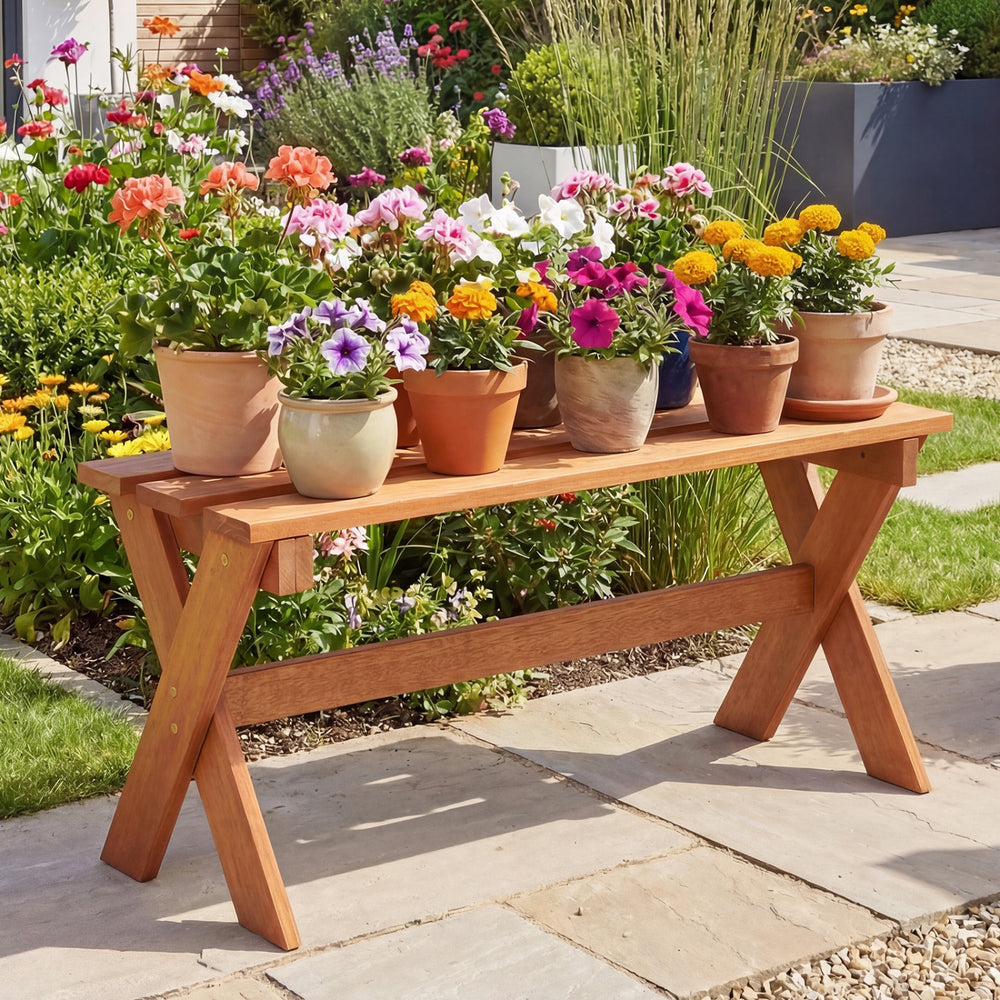 Solid wood backless patio dining bench with teak oil finish, featuring X-shaped legs, perfect for garden seating.