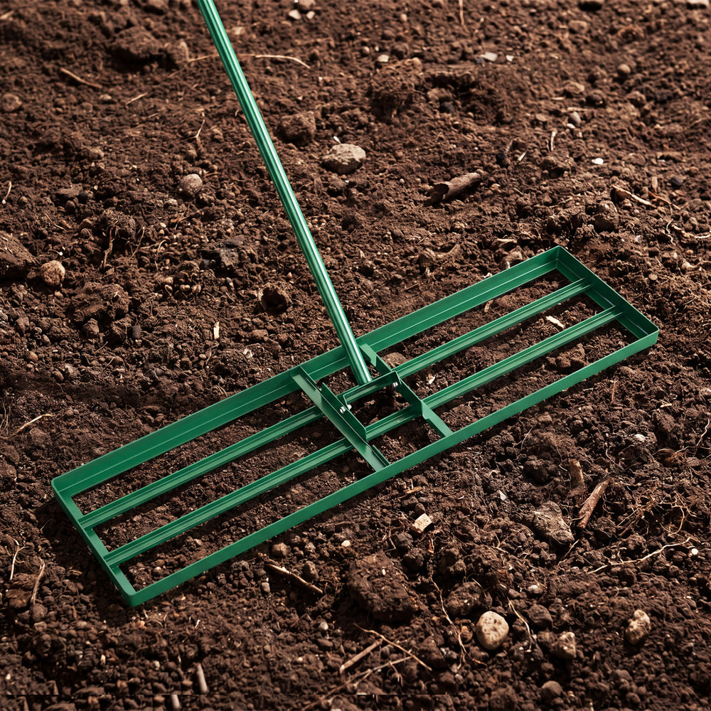 Lawn leveling rake with a 36 x 10 inch plate and ergonomic handle, perfect for leveling grass surfaces in gardens.