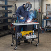 Welding table with lockable wheels, 144 fixture holes, and tool slots for organized workspace efficiency.