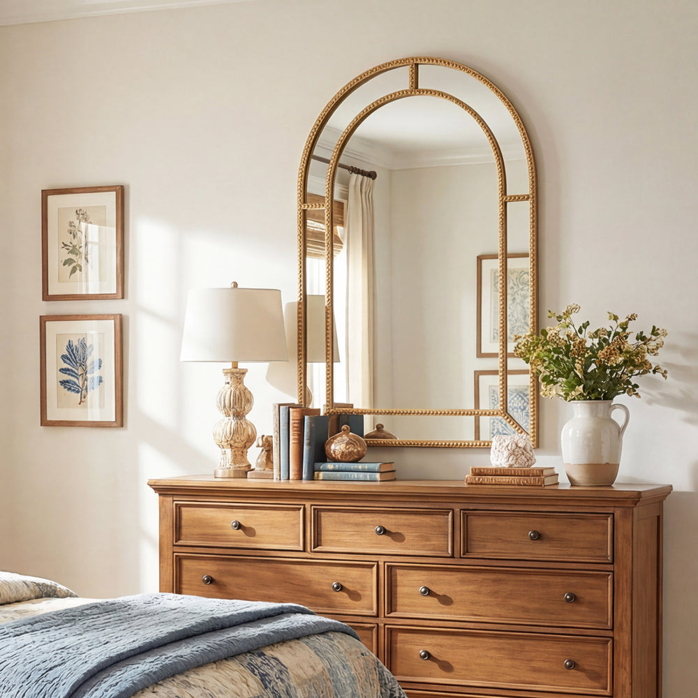 Gold beaded decorative mirror, 36 x 24 inches, adds timeless elegance to living rooms and entryways.