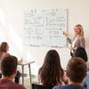 Glass whiteboard 36" x 24" with eraser and removable tray, shown in classroom setting with teacher and students.