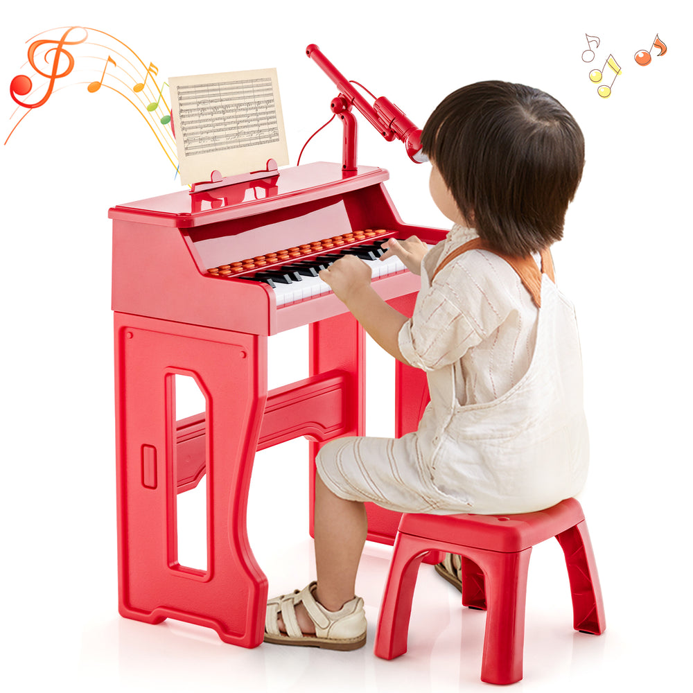 Kids playing the red 37 keys music piano with microphone and detachable music stand for fun music learning.