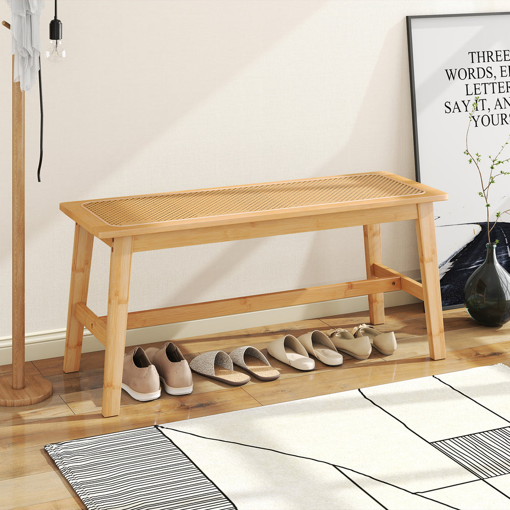 Bamboo dining bench with handwoven rattan seat, 39.5 inches long, ideal for indoor or outdoor use, supports 660 lbs.