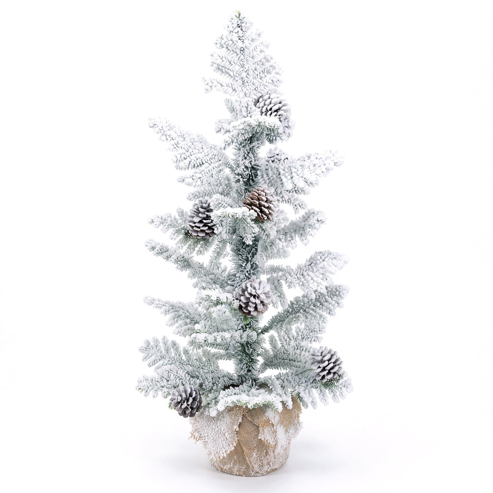 Snow-flocked 3FT mini tabletop Christmas tree with pine cones and a stable linen-wrapped base for festive decor.