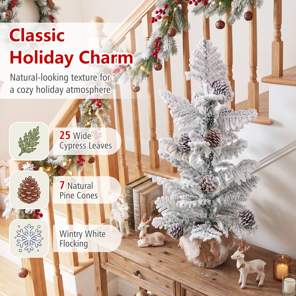 3FT mini tabletop Christmas tree features snow flocked PE leaves, 7 pine cones, and a stable linen-wrapped base for festive decor.