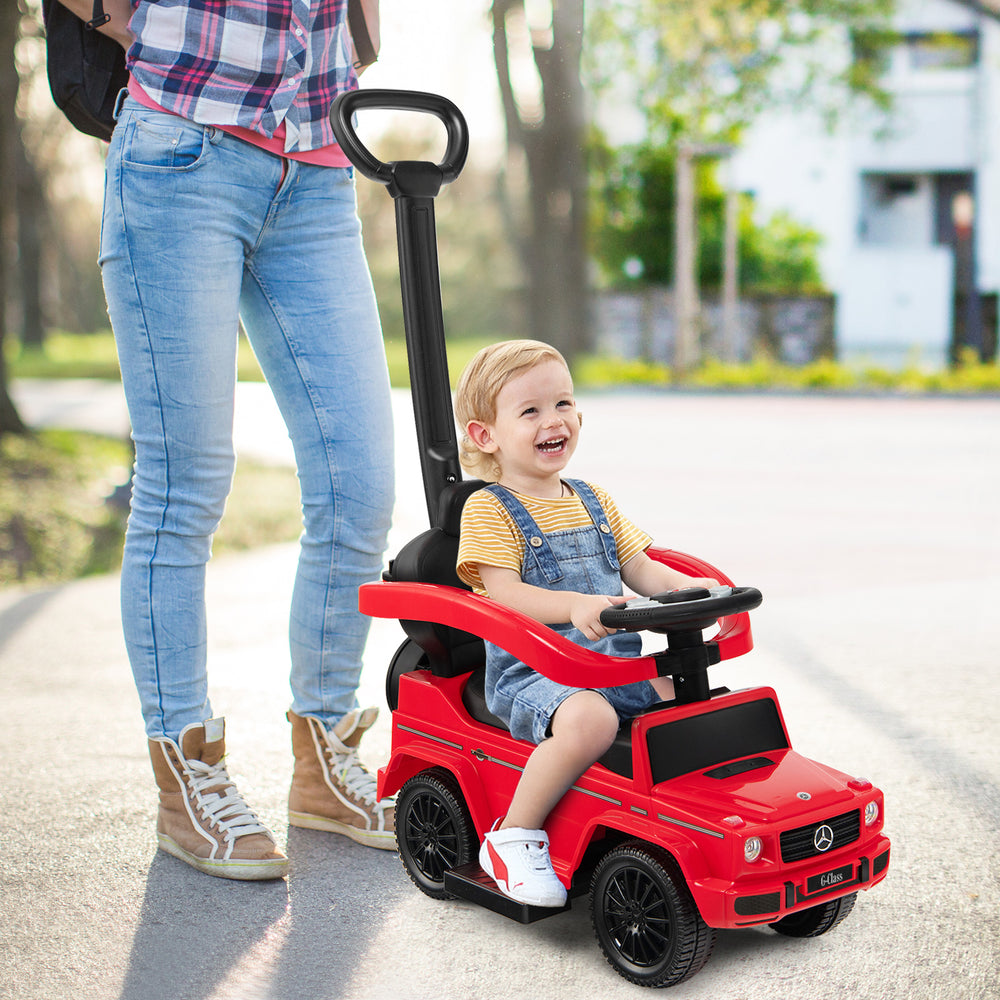 Red 3-in-1 ride-on push car Mercedes Benz G350 with adjustable canopy, suitable for kids 1-3 years old, in use outdoors.