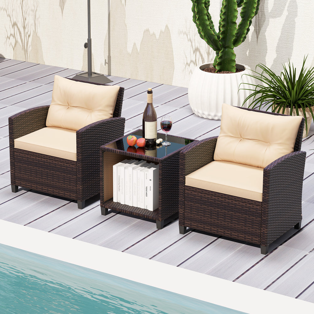 Two wicker chairs with beige cushions and a coffee table, perfect for outdoor relaxation by the poolside.