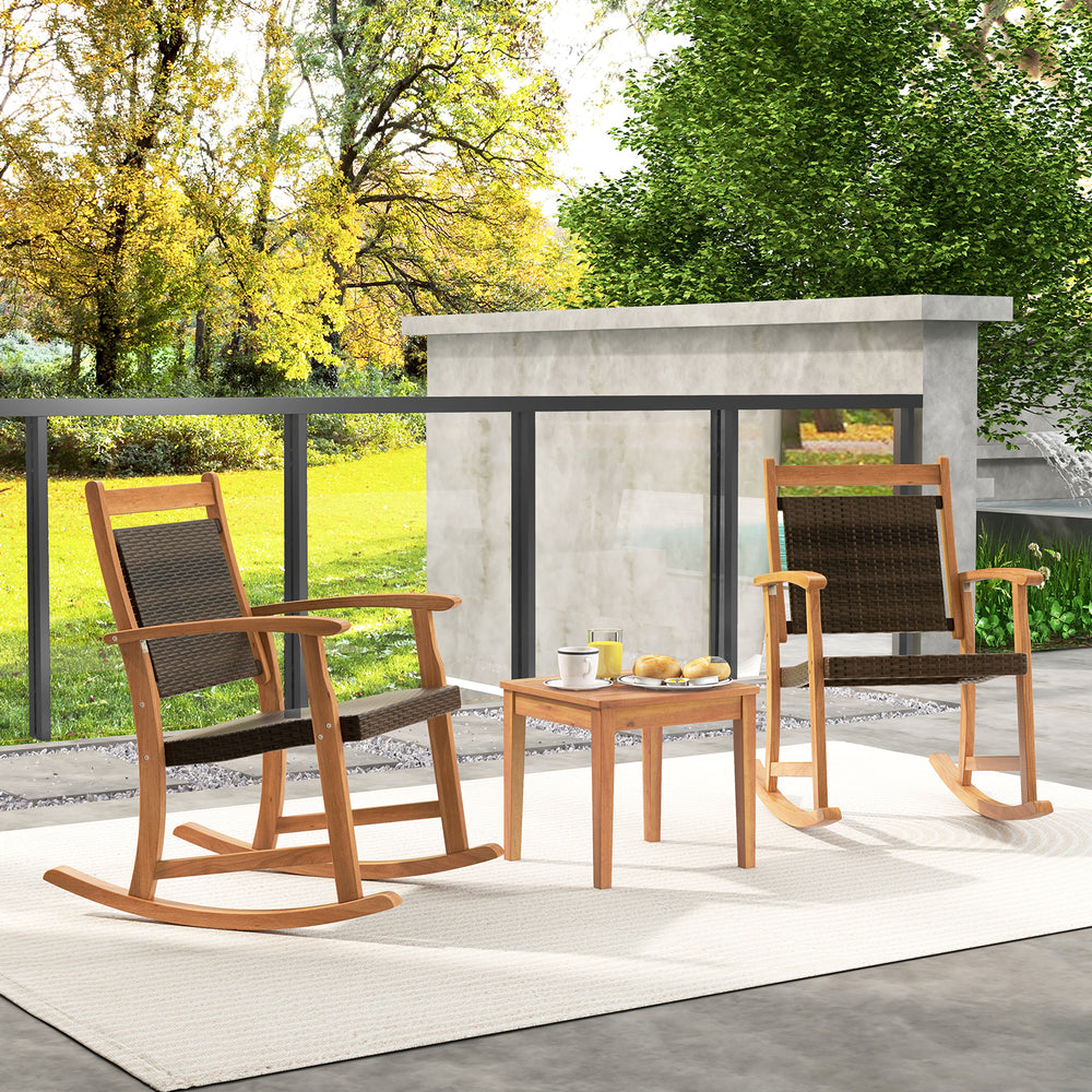 Side view of the acacia wood patio rocking chairs with a stylish side table, perfect for backyard gatherings and.