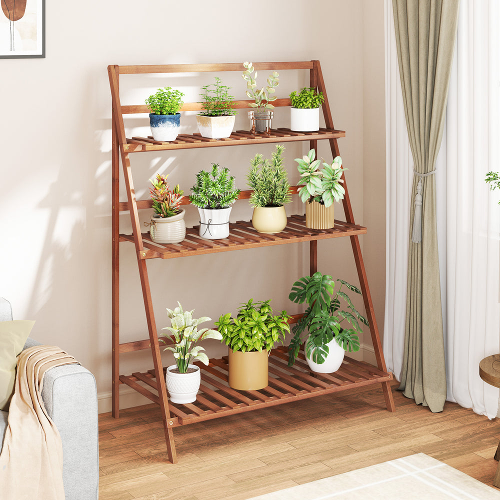 3-tier bamboo ladder shelf in brown, ideal for indoor or outdoor plant display with a foldable design for easy storage.