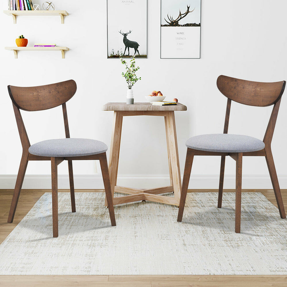 Set of 2 dining chairs with upholstered curved back and rubber wood legs, perfect for kitchen or dining room use.