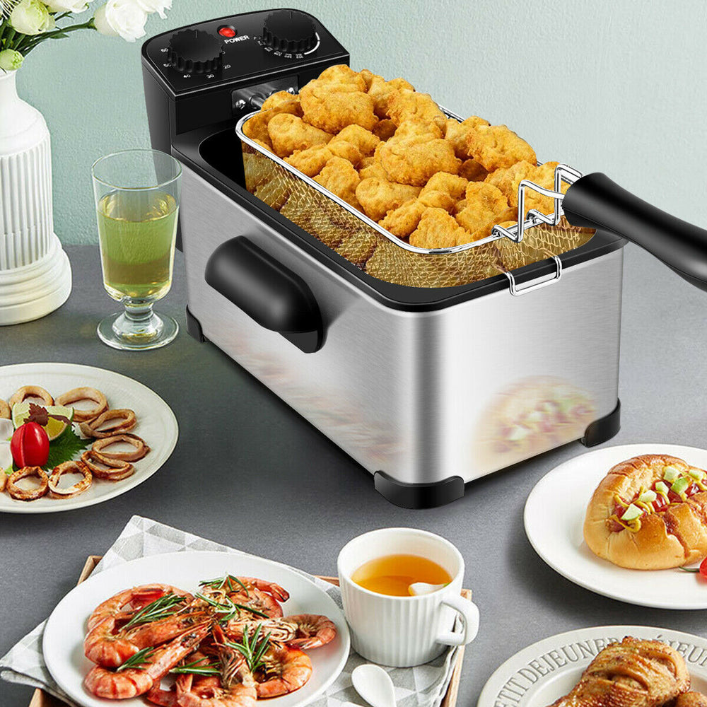 Electric stainless steel deep fryer with 3.2 qt capacity, frying chicken and shrimp, featuring a timer and adjustable.