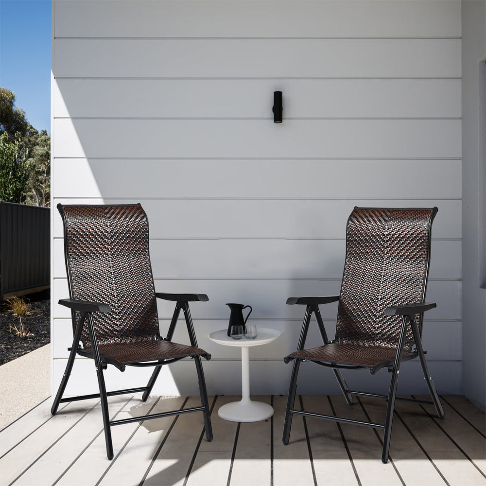 Two folding rattan reclining chairs with a steel frame, perfect for outdoor relaxation on a patio or garden.
