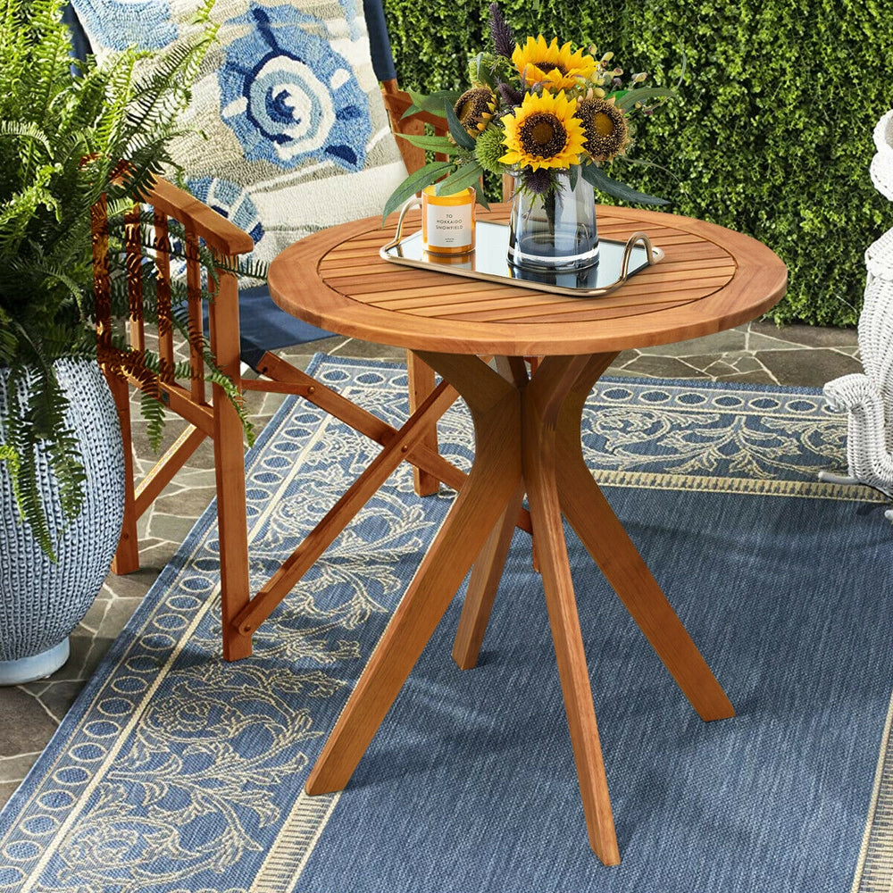 Round solid wood coffee side bistro table with X-shaped legs, teak color, perfect for outdoor or indoor use.