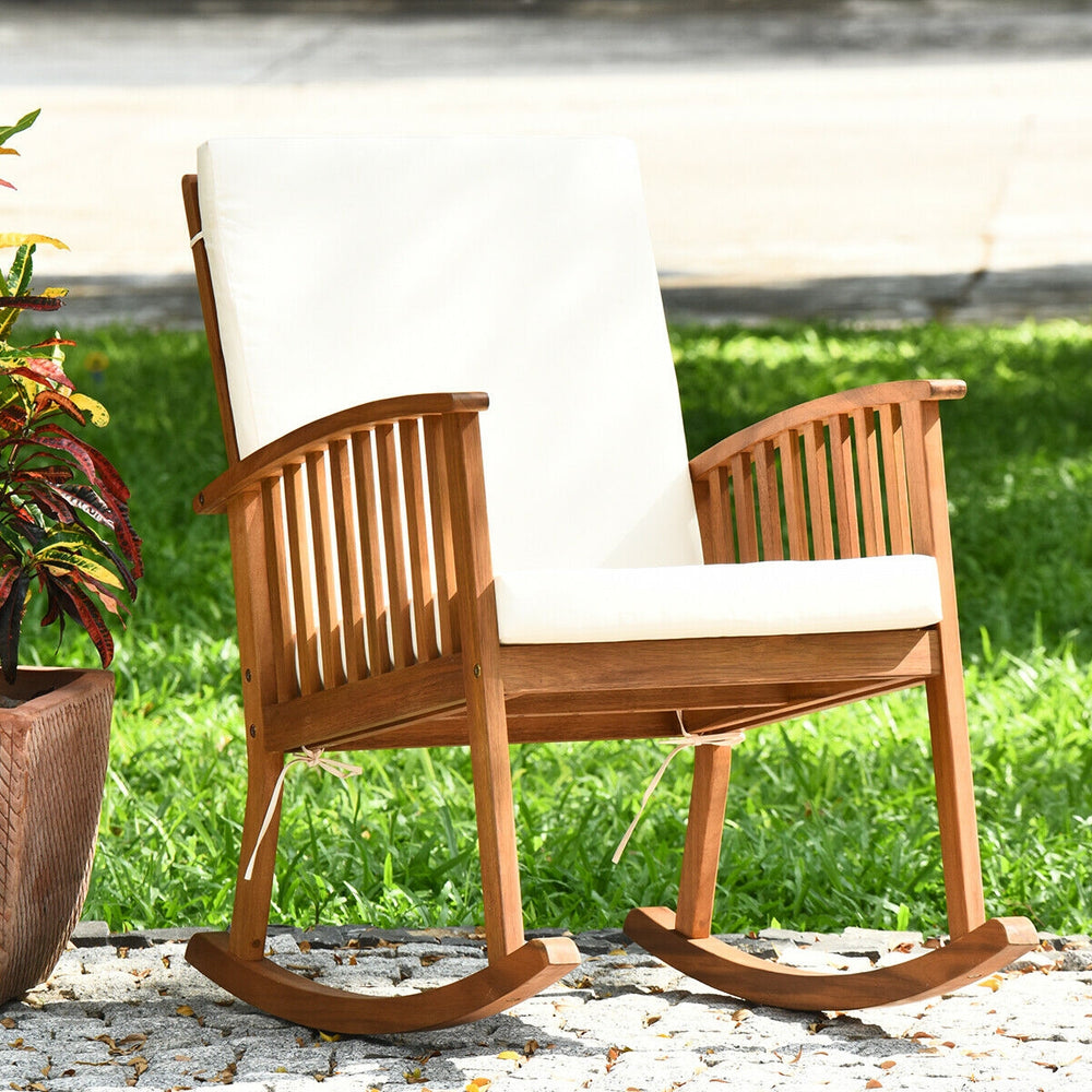 Acacia wood rocking chair with detachable washable cushions, featuring a rustic teak color, perfect for patio or garden.