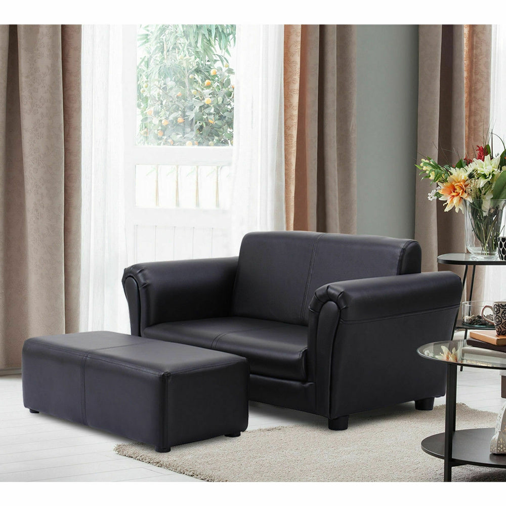 Kids black double sofa with matching ottoman, perfect for playrooms and reading, made from comfortable material.