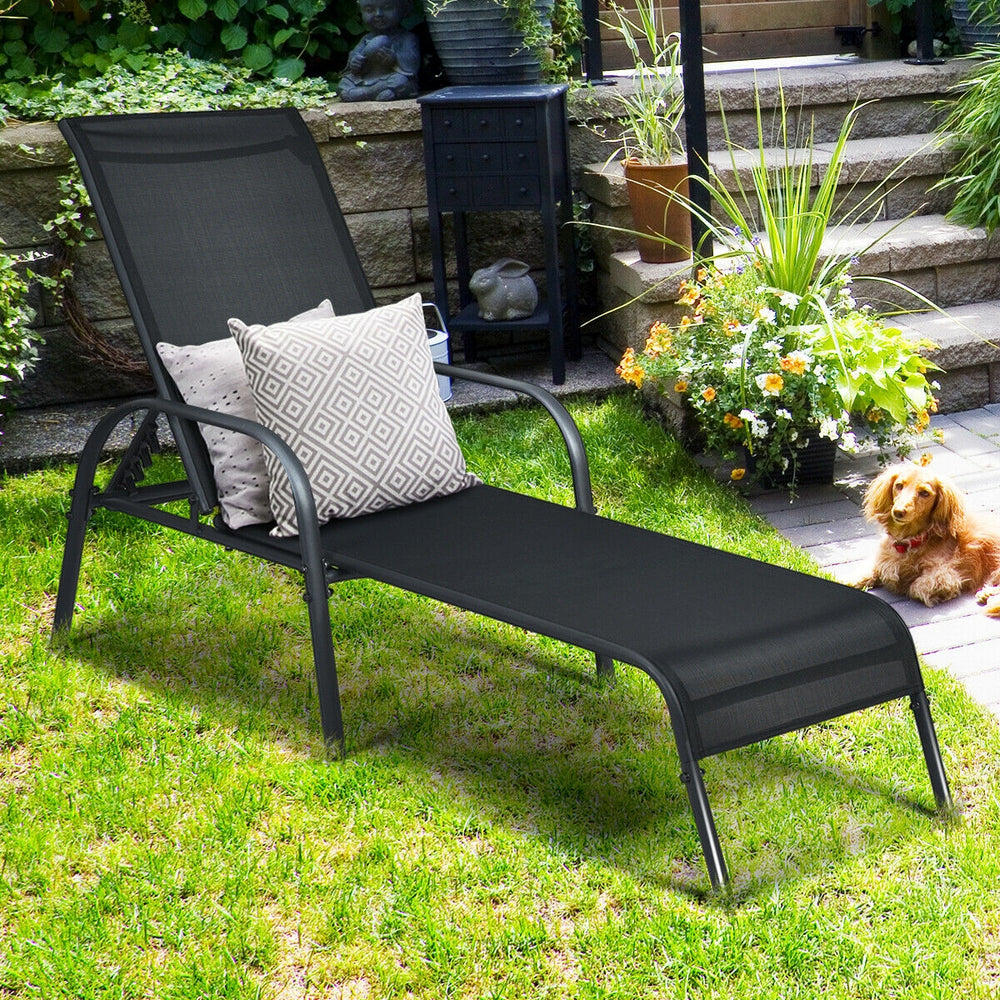 Adjustable black patio chaise lounge chair with breathable fabric and curved armrests, perfect for outdoor relaxation.