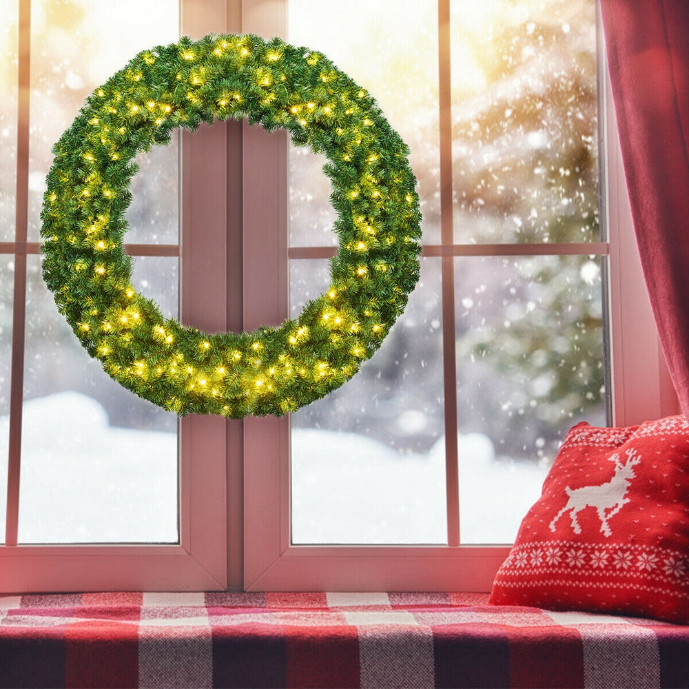 48-inch pre-lit artificial Christmas wreath with 200 LED lights, lush green design, perfect for indoor or outdoor.