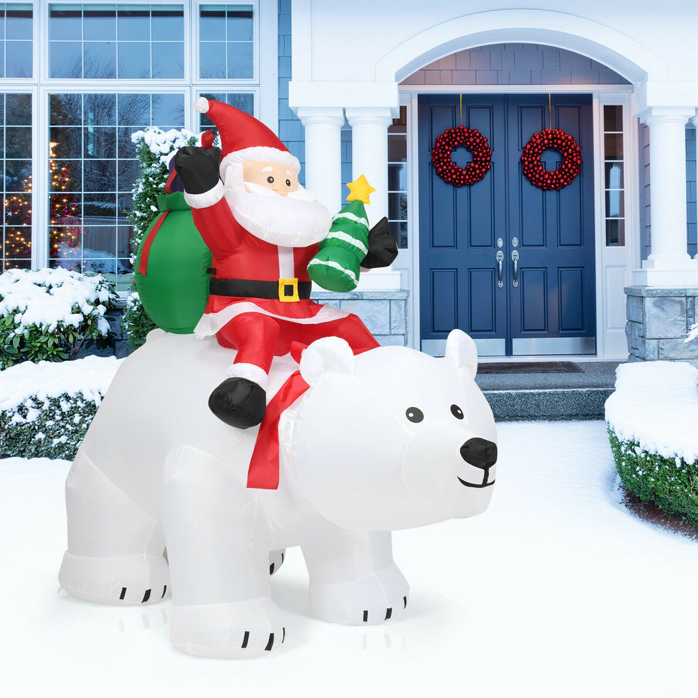 Christmas inflatable Santa riding a polar bear, 6.5 feet tall, with LED lights, perfect for festive outdoor decoration.