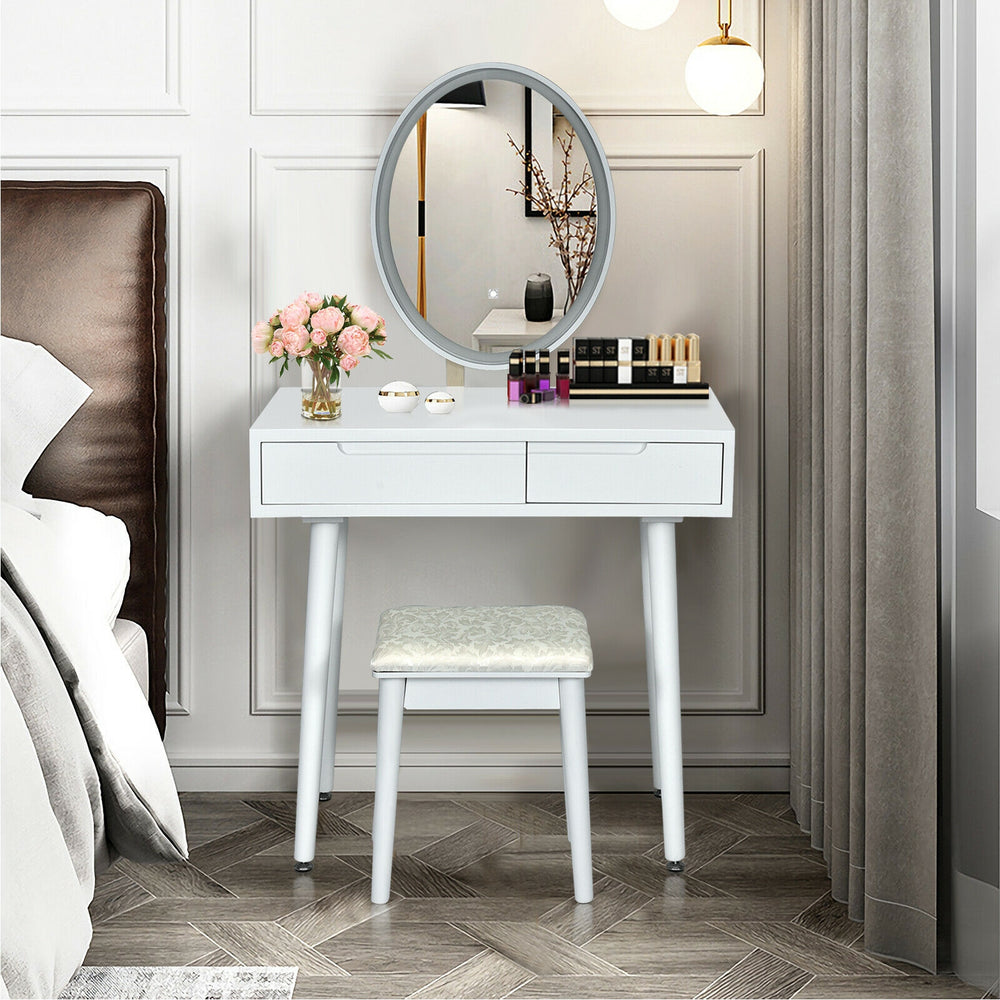 White vanity makeup table set with lighted elliptical mirror, two drawers, and cushioned stool for stylish organization.