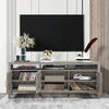 Gray universal TV stand with three cabinets and open shelf, suitable for TVs up to 65 inches, ideal for storage and.