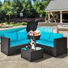 Turquoise cushioned loveseat and coffee table from a 4-piece outdoor patio rattan furniture set, ideal for poolside.