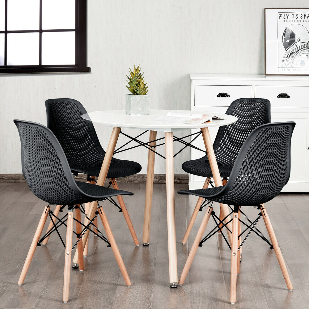 Modern black plastic hollow chair set with wood legs, featuring ergonomic mesh design for comfort and breathability.