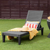 Outdoor recliner chair in black with adjustable backrest, perfect for patio relaxation and easy transport.