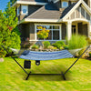 Hammock chair stand set with blue cotton fabric, pillow, and cup holder, perfect for outdoor relaxation in the garden.