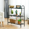 Black 3-tier metal plant stand with scrollwork design, perfect for organizing plants and decor in any space.
