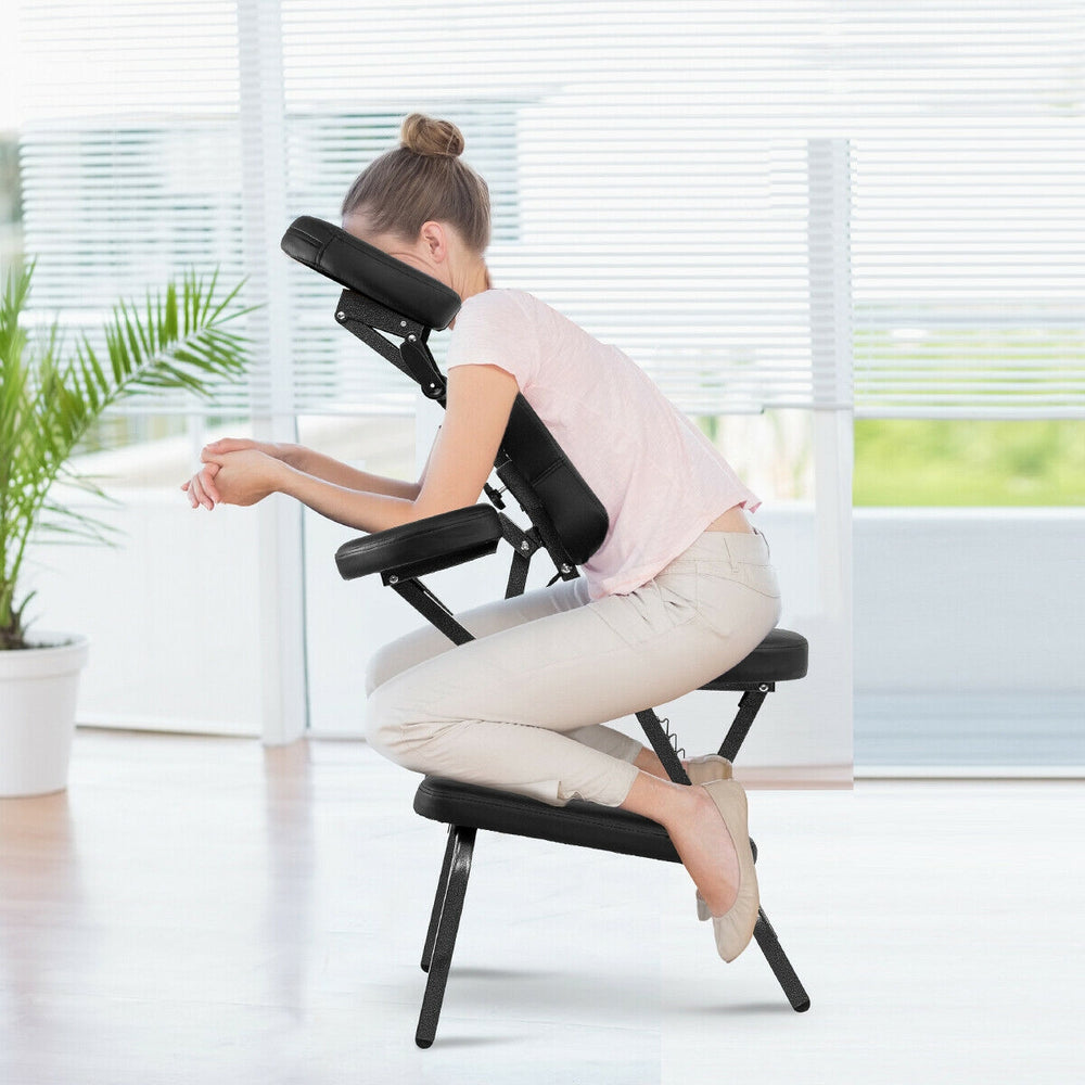 Foldable PU leather travel massage chair with adjustable face cradle and armrest, ideal for relaxation and portability.